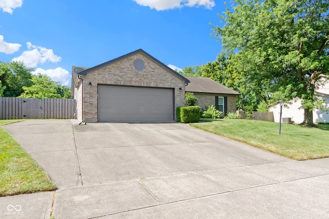 7683 Madden Dr, Fishers, IN 46038 - single story home with brick siding, driveway, a garage, and a gate