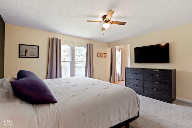 7683 Madden Dr, Fishers, IN 46038 - bedroom with light carpet, a ceiling fan, and a textured ceiling