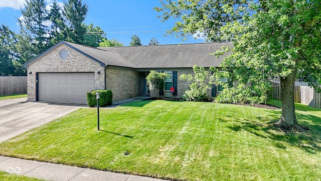 7683 Madden Dr, Fishers, IN 46038 - ranch-style house featuring a garage, driveway, brick siding, and roof with shingles