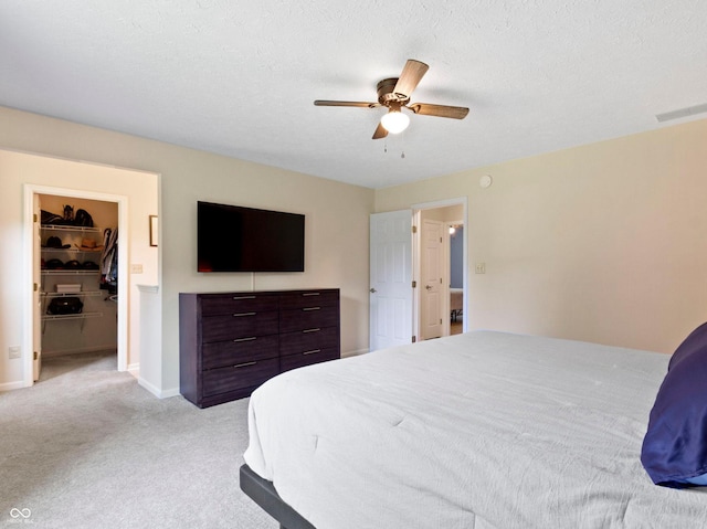 7683 Madden Dr, Fishers, IN 46038 - bedroom featuring light carpet, a spacious closet, and a ceiling fan