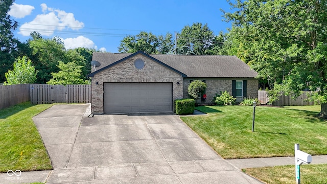 7683 Madden Dr, Fishers, IN 46038 - view of front facade featuring brick siding, a garage, driveway, a shingled roof, and a gate