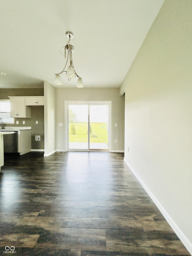 10 Doe Creek Cir, Cloverdale, IN 46120 - unfurnished living room with dark wood-style flooring and a chandelier