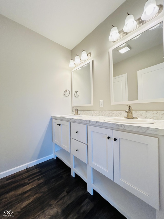 10 Doe Creek Cir, Cloverdale, IN 46120 - bathroom featuring double vanity and wood finished floors