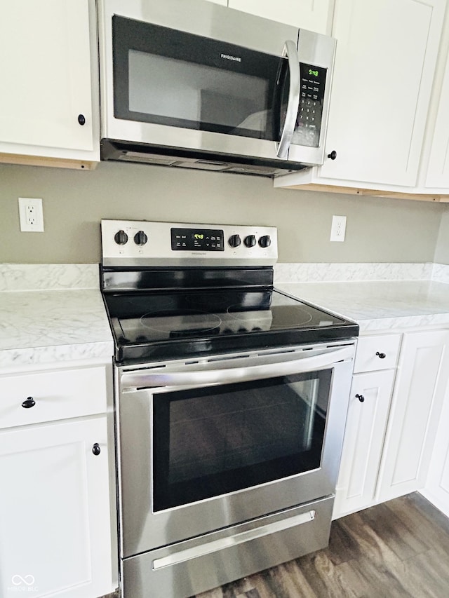 10 Doe Creek Cir, Cloverdale, IN 46120 - kitchen with stainless steel appliances, dark wood-style floors, and white cabinets
