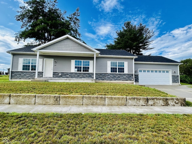 10 Doe Creek Cir, Cloverdale, IN 46120 - view of front of property with stone siding, a garage, concrete driveway, and a front yard