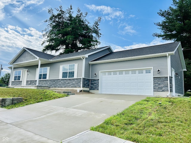 10 Doe Creek Cir, Cloverdale, IN 46120 - view of front of home featuring stone siding, an attached garage, driveway, and a front yard