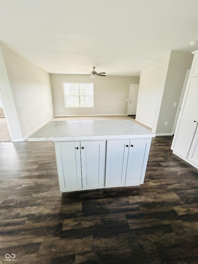 10 Doe Creek Cir, Cloverdale, IN 46120 - kitchen featuring open floor plan, dark wood-type flooring, ceiling fan, and light stone countertops