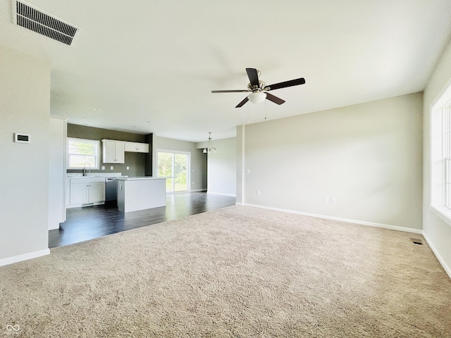 10 Doe Creek Cir, Cloverdale, IN 46120 - unfurnished living room with dark colored carpet and a ceiling fan
