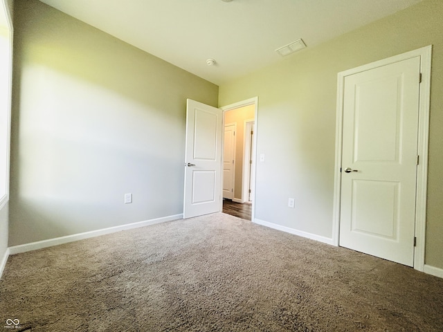 10 Doe Creek Cir, Cloverdale, IN 46120 - unfurnished bedroom with dark carpet and baseboards