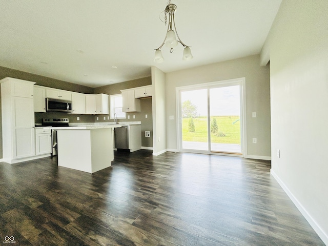 10 Doe Creek Cir, Cloverdale, IN 46120 - kitchen with stainless steel appliances, a center island, white cabinets, and dark wood-type flooring