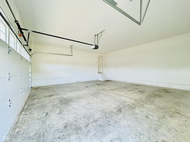 10 Doe Creek Cir, Cloverdale, IN 46120 - garage with a garage door opener and baseboards