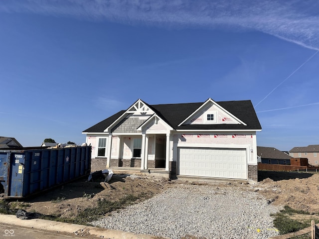 9417 Crimson Cir, Lapel, IN 46051 - unfinished property featuring brick siding, a garage, driveway, and a porch