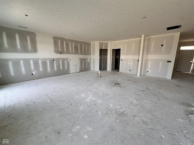 9417 Crimson Cir, Lapel, IN 46051 - unfurnished living room with a textured ceiling