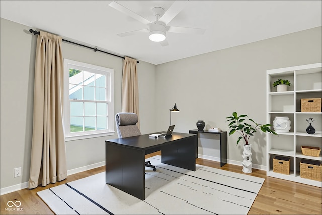 6711 Lafayette Rd, Indianapolis, IN 46278 - office area featuring wood finished floors and a ceiling fan