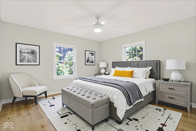 6711 Lafayette Rd, Indianapolis, IN 46278 - bedroom with light wood-style flooring and a ceiling fan