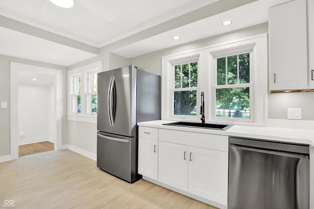 6711 Lafayette Rd, Indianapolis, IN 46278 - kitchen with stainless steel appliances, light countertops, white cabinets, light wood finished floors, and recessed lighting