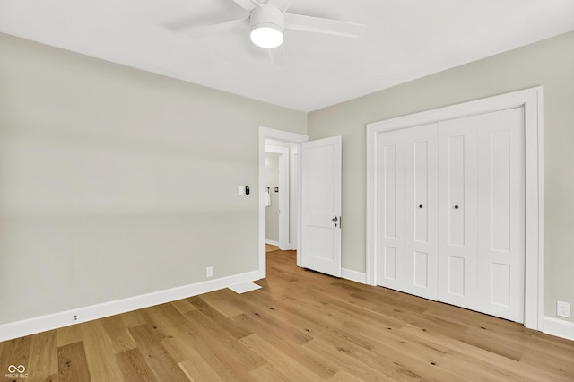 6711 Lafayette Rd, Indianapolis, IN 46278 - unfurnished bedroom with light wood finished floors, a closet, and ceiling fan