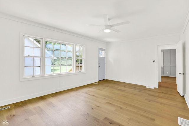 6711 Lafayette Rd, Indianapolis, IN 46278 - unfurnished room with ornamental molding, a ceiling fan, and light wood-type flooring
