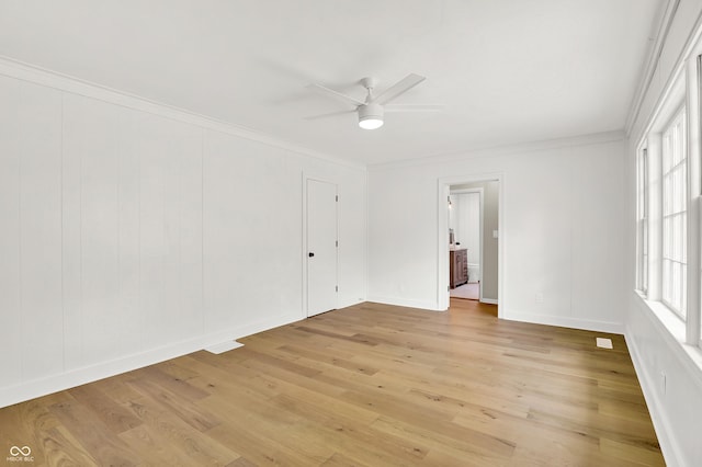 6711 Lafayette Rd, Indianapolis, IN 46278 - empty room featuring a ceiling fan, crown molding, and light wood-type flooring