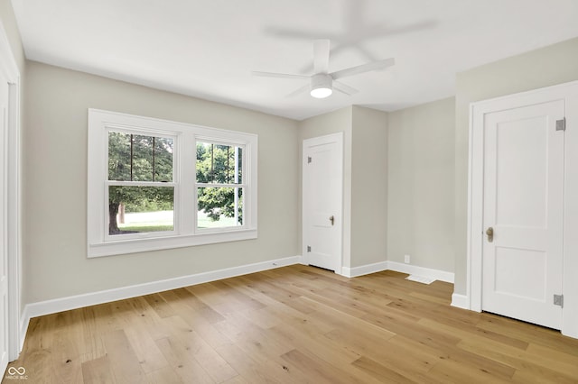 6711 Lafayette Rd, Indianapolis, IN 46278 - unfurnished bedroom featuring light wood-style floors and ceiling fan
