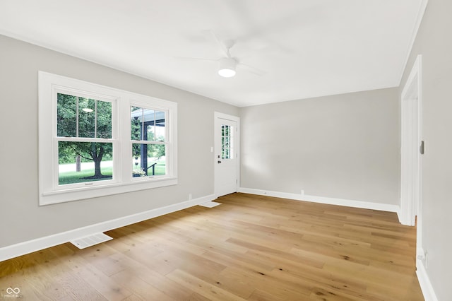 6711 Lafayette Rd, Indianapolis, IN 46278 - spare room featuring light wood finished floors and a ceiling fan