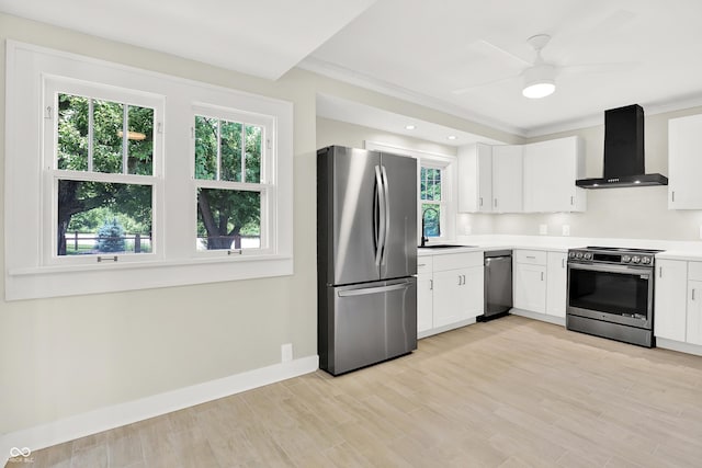 6711 Lafayette Rd, Indianapolis, IN 46278 - kitchen with appliances with stainless steel finishes, wall chimney range hood, white cabinetry, light countertops, and ornamental molding