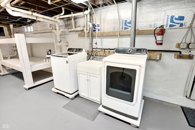 6711 Lafayette Rd, Indianapolis, IN 46278 - washroom featuring cabinet space and separate washer and dryer