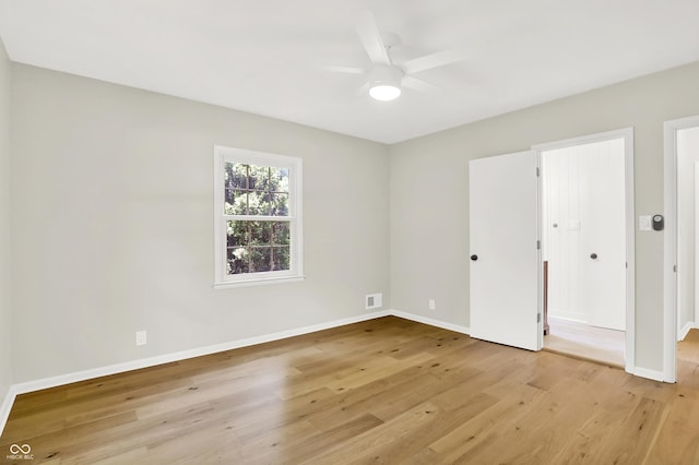 6711 Lafayette Rd, Indianapolis, IN 46278 - unfurnished bedroom with light wood-style floors and a ceiling fan