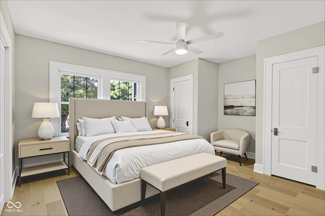 6711 Lafayette Rd, Indianapolis, IN 46278 - bedroom with light wood-style flooring and ceiling fan