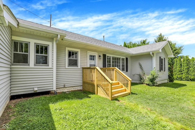 6711 Lafayette Rd, Indianapolis, IN 46278 - back of property with a yard and roof with shingles