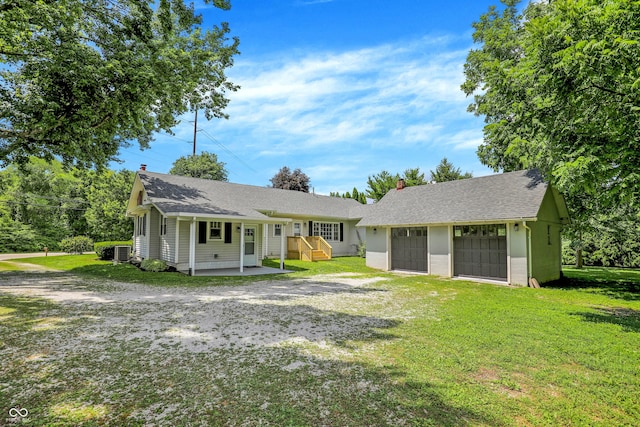 6711 Lafayette Rd, Indianapolis, IN 46278 - rear view of property with driveway, a chimney, and a yard