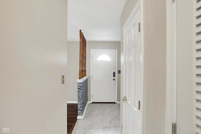 3302 Beech Dr, Columbus, IN 47203 - hallway featuring light marble finish flooring and baseboards