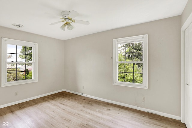 3302 Beech Dr, Columbus, IN 47203 - empty room with light wood finished floors and ceiling fan
