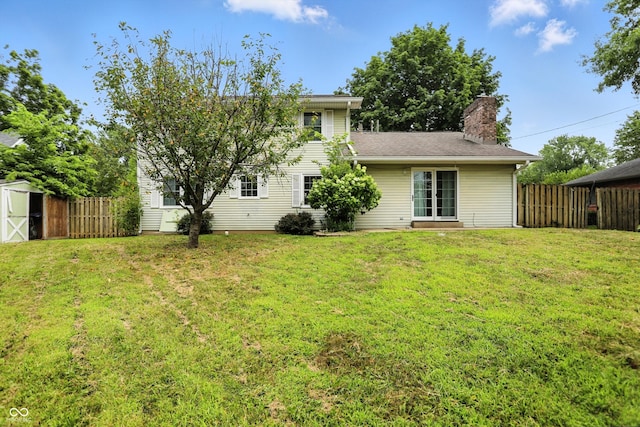3302 Beech Dr, Columbus, IN 47203 - rear view of house with a chimney and a storage shed