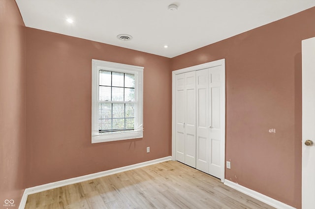 3302 Beech Dr, Columbus, IN 47203 - unfurnished bedroom with light wood finished floors and a closet