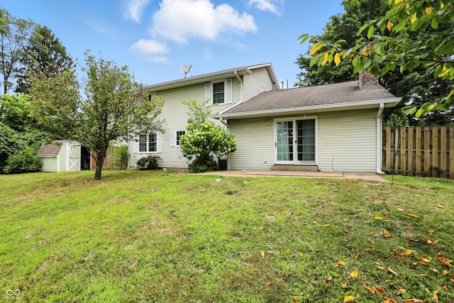 3302 Beech Dr, Columbus, IN 47203 - back of property with a patio, a chimney, and a storage shed