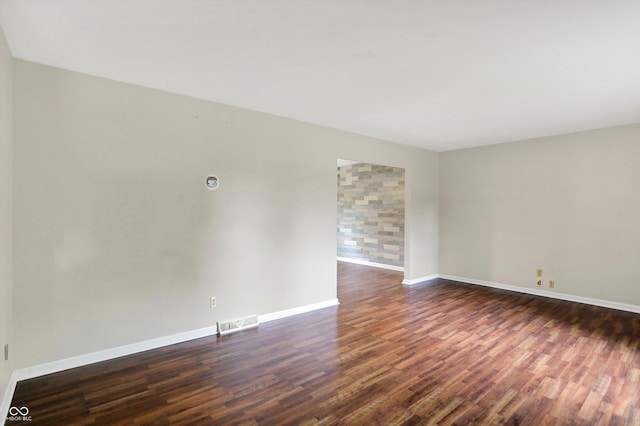 3302 Beech Dr, Columbus, IN 47203 - unfurnished room with dark wood-style flooring