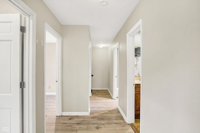 3302 Beech Dr, Columbus, IN 47203 - hallway with light wood-type flooring and baseboards