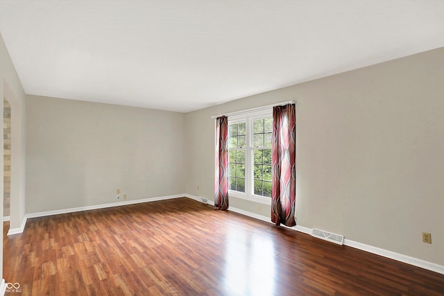 3302 Beech Dr, Columbus, IN 47203 - spare room with dark wood-style floors and baseboards