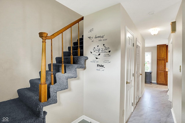 3302 Beech Dr, Columbus, IN 47203 - staircase featuring baseboards and marble finish flooring