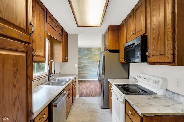 3302 Beech Dr, Columbus, IN 47203 - kitchen featuring white range with electric cooktop, dishwasher, brown cabinets, light marble finish flooring, and light countertops