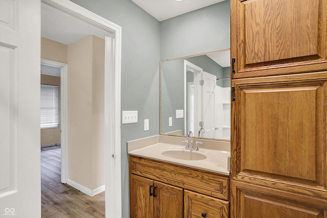 3302 Beech Dr, Columbus, IN 47203 - bathroom featuring wood finished floors and vanity