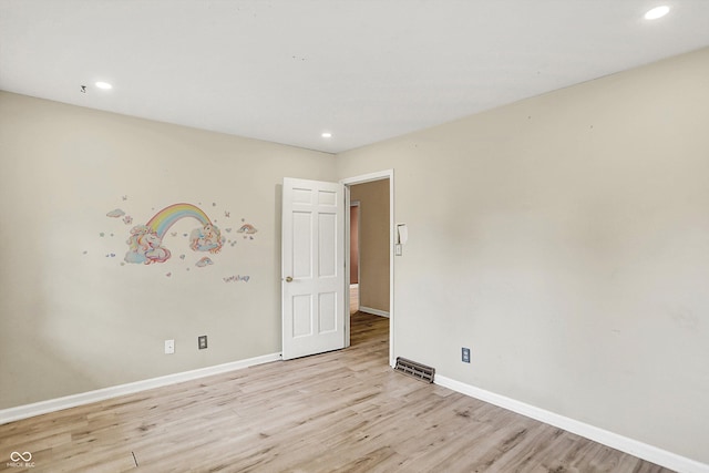 3302 Beech Dr, Columbus, IN 47203 - empty room featuring light wood-type flooring and recessed lighting