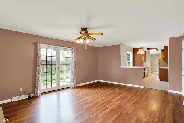 3302 Beech Dr, Columbus, IN 47203 - unfurnished living room featuring a ceiling fan and light wood-type flooring