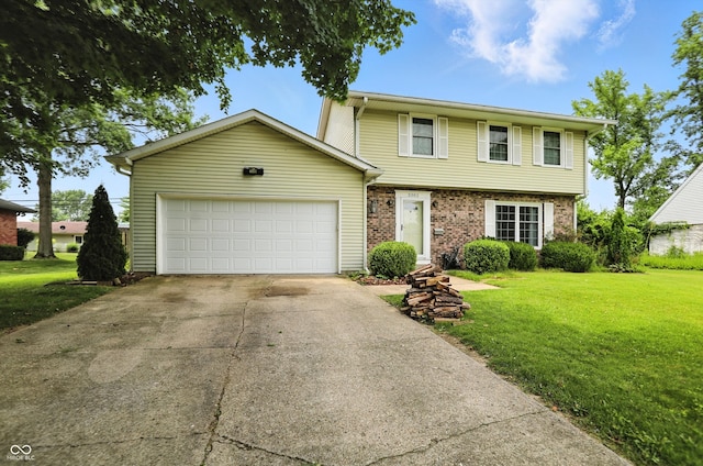 3302 Beech Dr, Columbus, IN 47203 - view of front of house featuring a front yard, a garage, concrete driveway, and brick siding