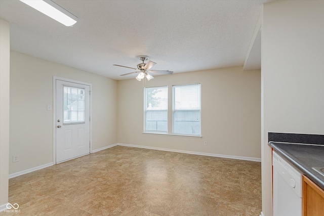 3183 Hemlock St, Whiteland, IN 46184 - unfurnished living room featuring healthy amount of natural light, ceiling fan, a textured ceiling, and light floors