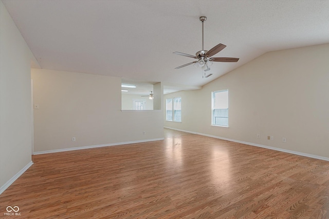 3183 Hemlock St, Whiteland, IN 46184 - empty room featuring a ceiling fan, light wood-style flooring, and lofted ceiling