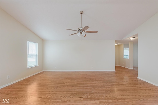 3183 Hemlock St, Whiteland, IN 46184 - empty room featuring vaulted ceiling, ceiling fan, and light wood-style flooring