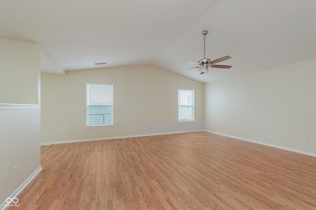 3183 Hemlock St, Whiteland, IN 46184 - empty room featuring light wood-type flooring, a ceiling fan, and vaulted ceiling