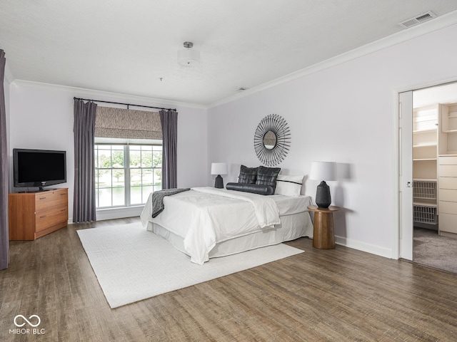 6730 Spirit Lake Dr Unit 202, Indianapolis, IN 46220 - bedroom with ornamental molding and wood finished floors